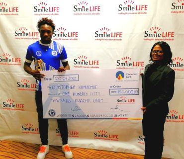 Mighty Mukuru Wanderers forward Christopher Kumwembe snatches the First Man of the match Award